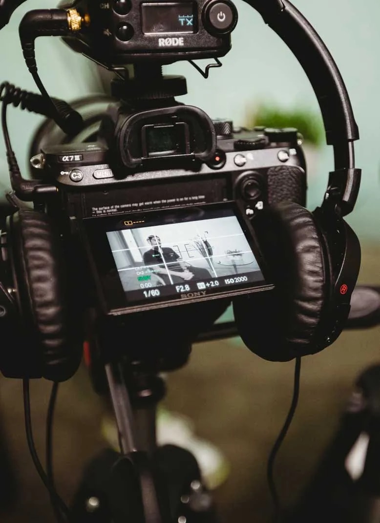 Photo of a video camera and headphones