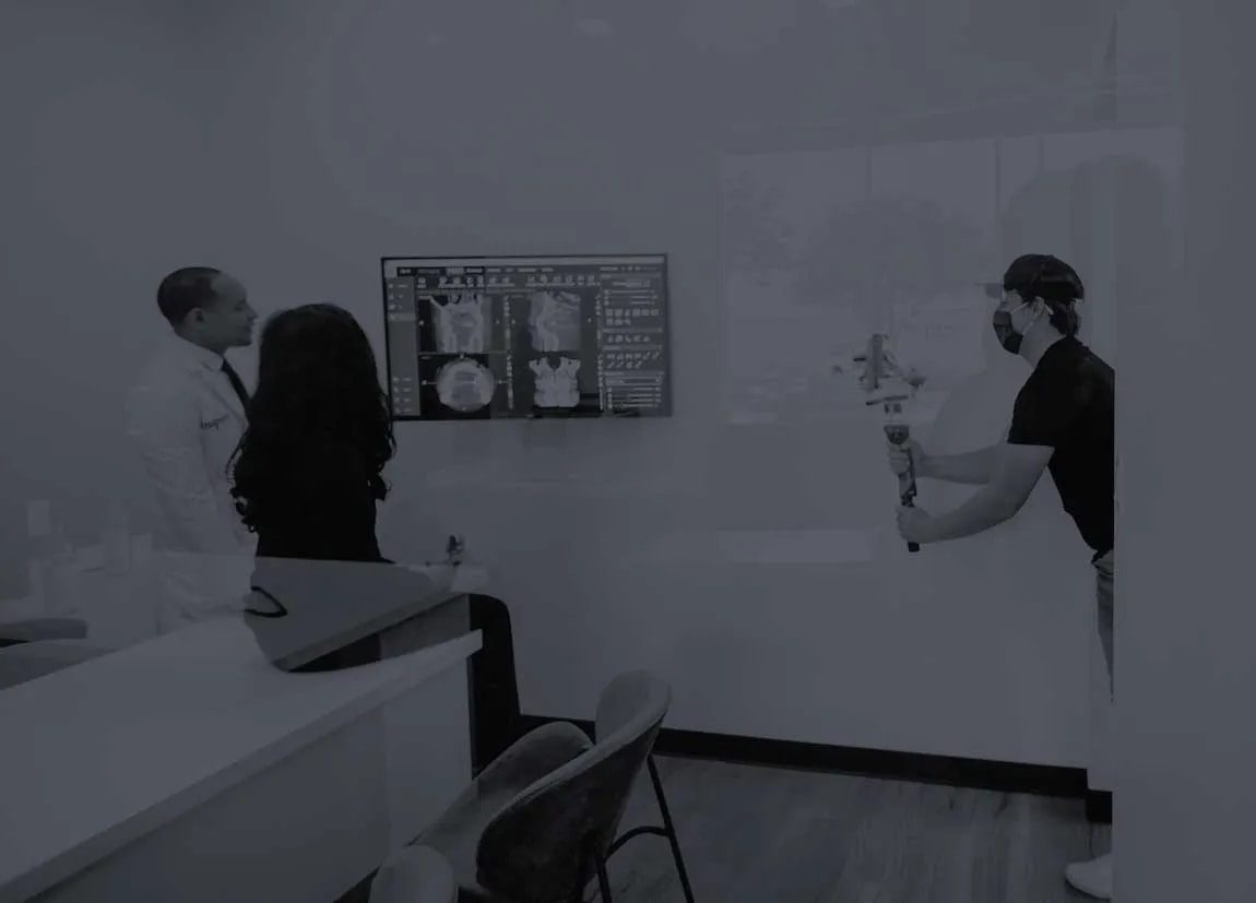 Photo of a videographer filming inside a dental practice