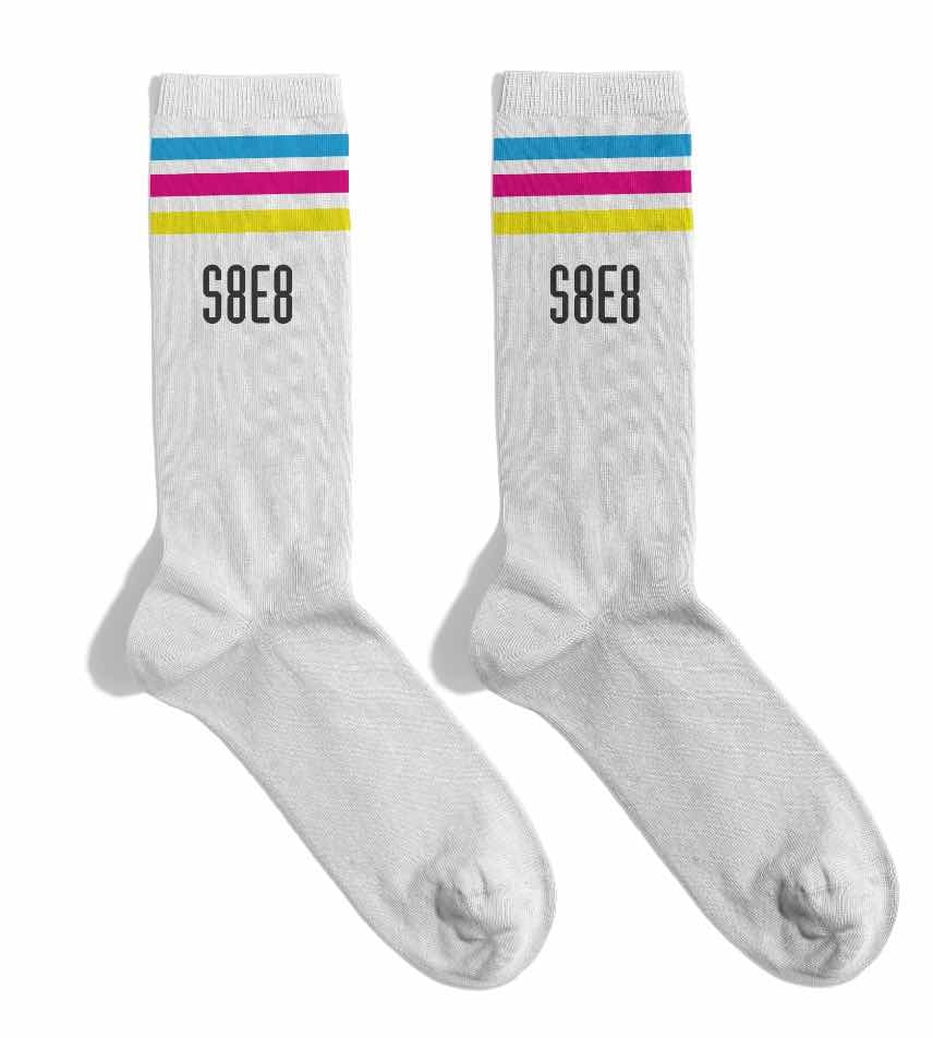 White S8E8 socks with three colorful stripes at the top